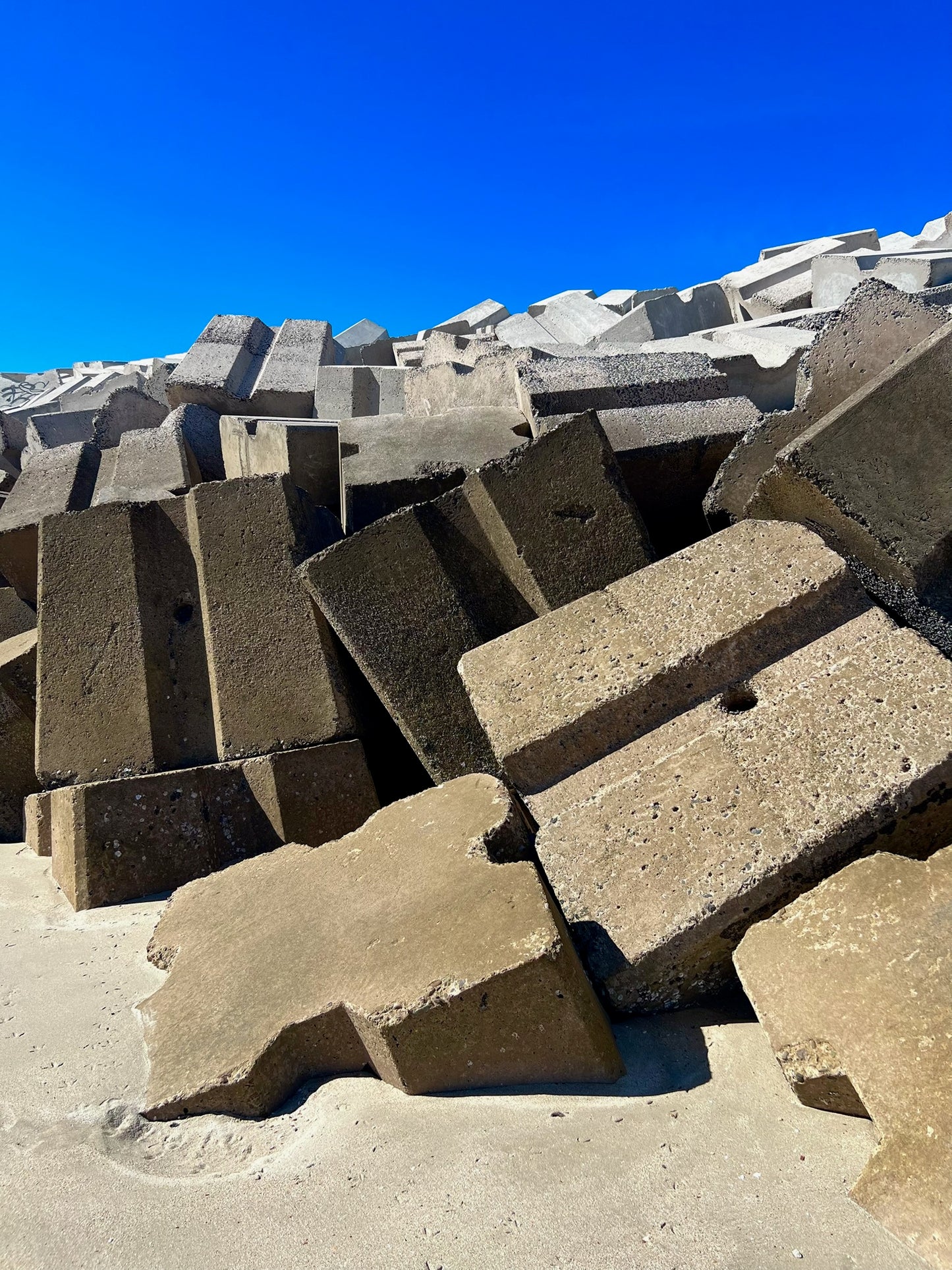 Coastal Breakwater Concrete Wall Art – Glossy Metal Photo Print | Industrial Sea Defense Abstract Décor